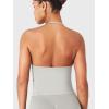 imageYEOREO SoftHue Impact Longline Strappy Top Womens Halter Workout Tank Tops Backless Gym Longline with Adjustable StrapFeather Rice