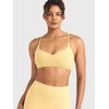 image:imageYEOREO CoreFlex Sports Bras for Women Workout Twist Cross Back Padded Adjustable Spaghetti Straps Gym Yoga TopsMilk Yellow