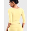 image:imageYEOREO Ease Womens 34 Sleeve Tops Workout Yoga Shirts  Double Lined Scoop Neck Slim Fit Soft Breathable Gym RunningCreamy Yellow